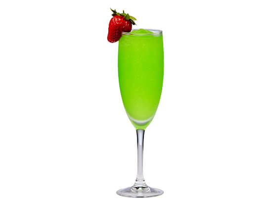 green coyote ugly cocktail with a strawberry on the rim of the glass