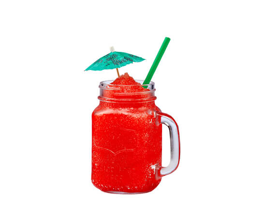 red sex on the beach cocktail with a paper umbrella on the rim of the glass