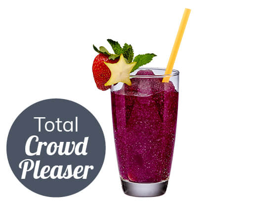 purple crowd pleaser cocktail with a strawberry on the rim of the glass